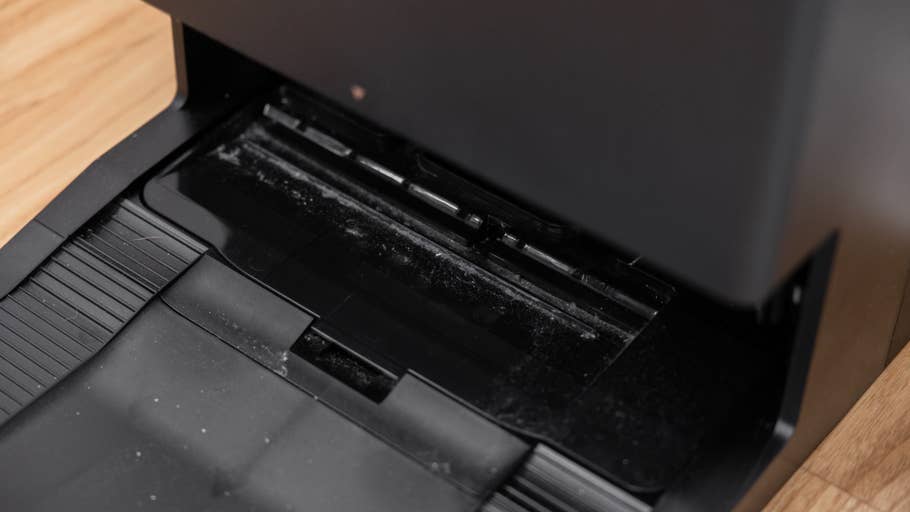 Close up of the Ecovacs Deebot X8 Pro Omniu0027s dust bin showing dirt buildup.