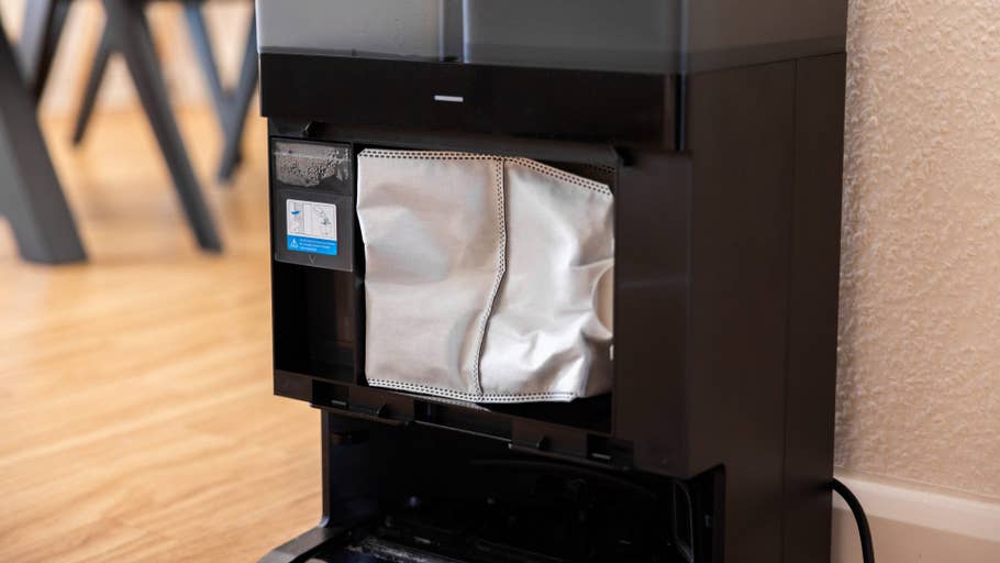 Close-up of the Ecovacs Deebot X8 Pro Omni dust container with a filter bag.