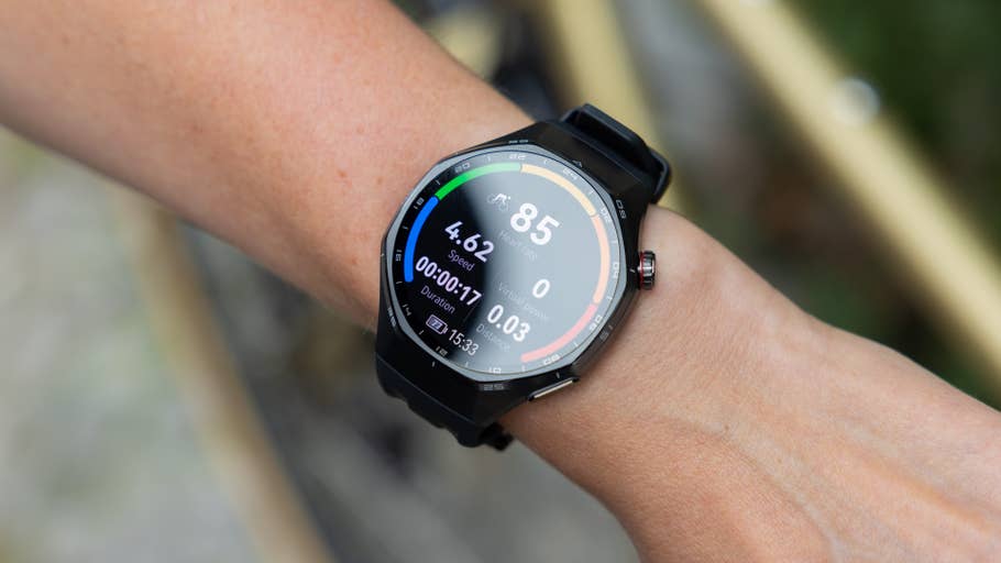 A close-up of a Huawei Watch GT 6 Pro on a wrist displaying speed, heart rate, and duration.