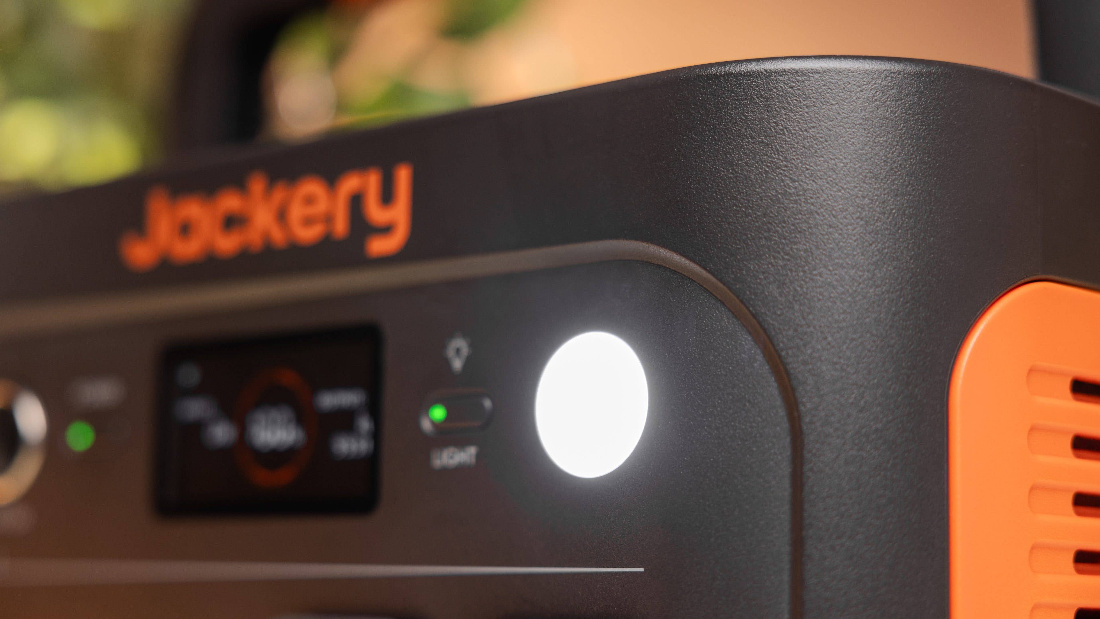 Close-up of a Jackery Explorer 1000 V2 with control panel and LED light.