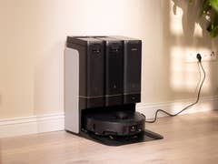 A Mova Z50 Ultra robotic vacuum cleaner with a charging station in a well-lit room.