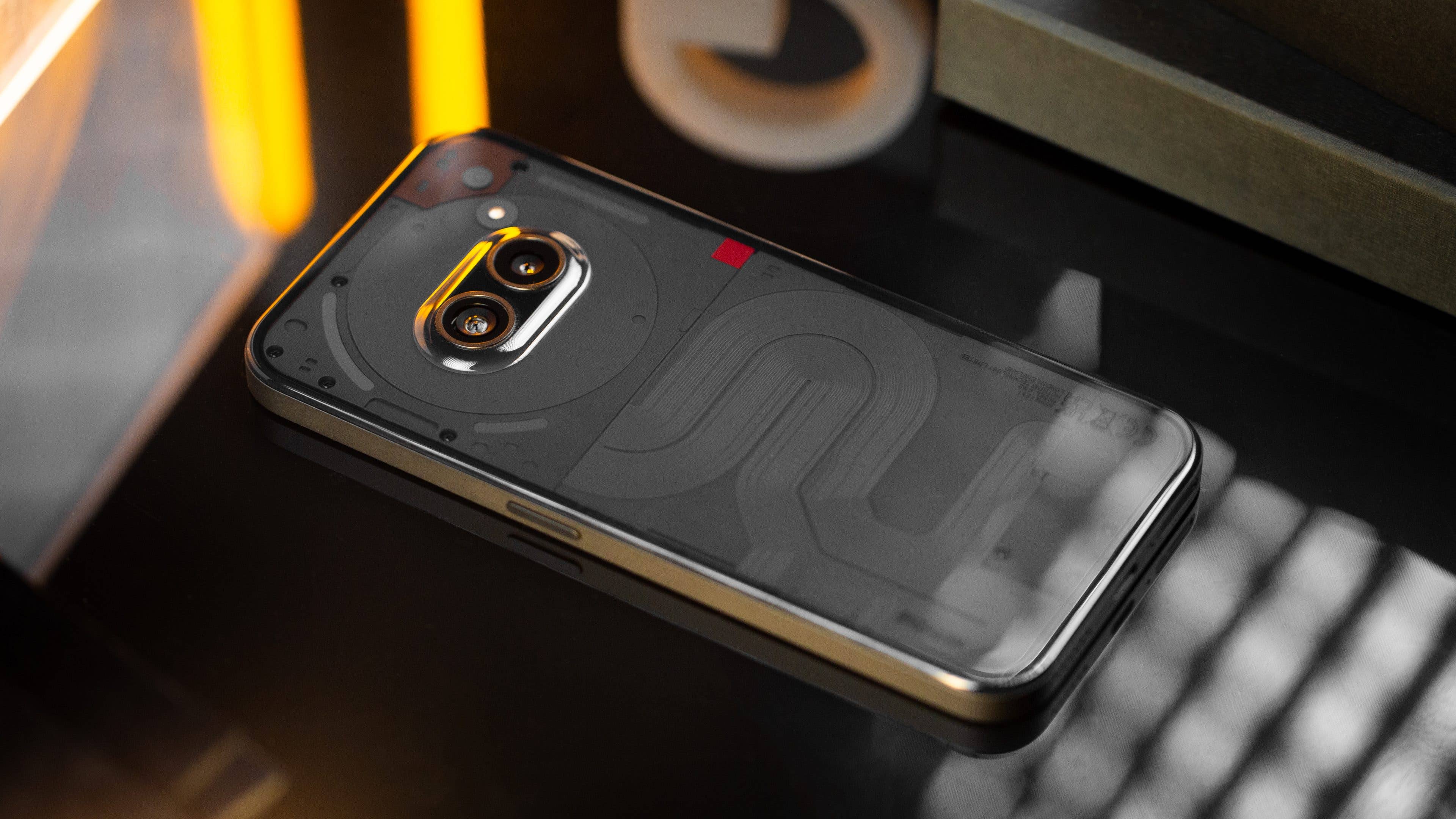 You get a plastic back instead of glass in the Nothing Phone 2(a). You get a plastic back instead of glass in the Nothing Phone 2(a).