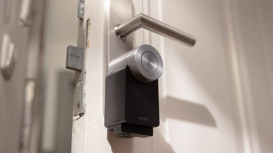 Nuki Smart Lock Pro installed on a door with a modern door handle.