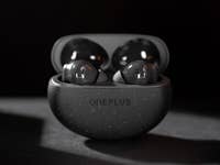 OnePlus Nord Buds 3 Pro in a speckled charging case, partially open.