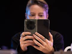 A person reading an article on the OnePlus Open main screen