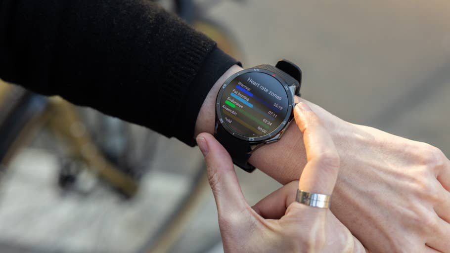 A close-up of a OnePlus Watch 3 displaying heart rate zones on a personu0027s wrist.