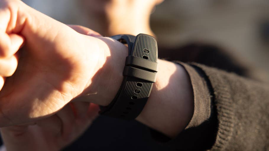A close-up of a wrist wearing a OnePlus Watch 3, showcasing its design and strap.