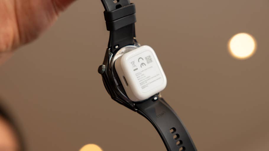 A close-up of the back of the OnePlus Watch 3, showing its design and information labels.