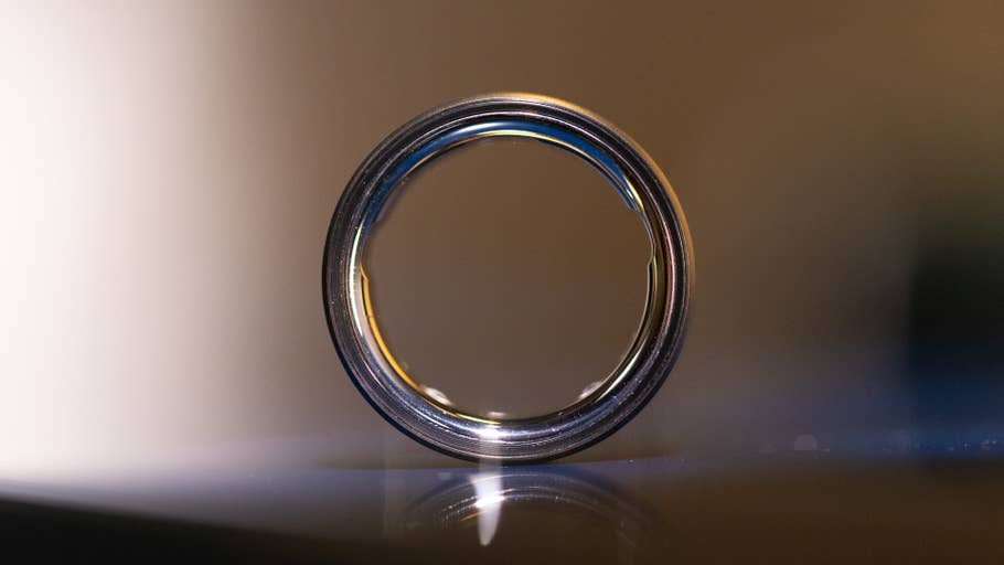A close-up of an Oura Ring, showcasing its sleek design and shiny surface.