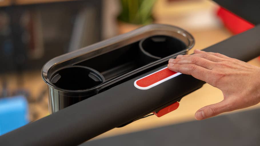 A person touching Peloton Treadu0027s stop button