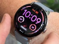 A Google Pixel Watch 4 displaying the time 10:09 and fitness stats on a wrist.