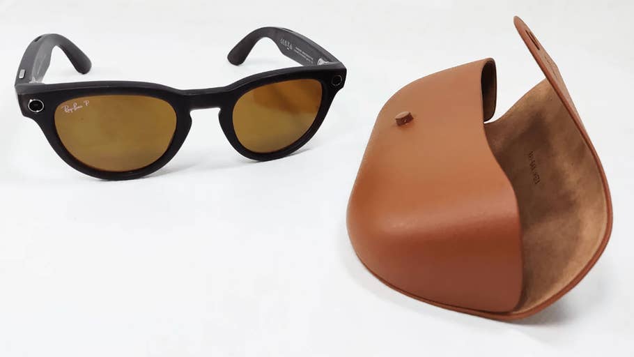 Ray-Ban Meta Headliner sunglasses with brown lenses next to a brown leather case.
