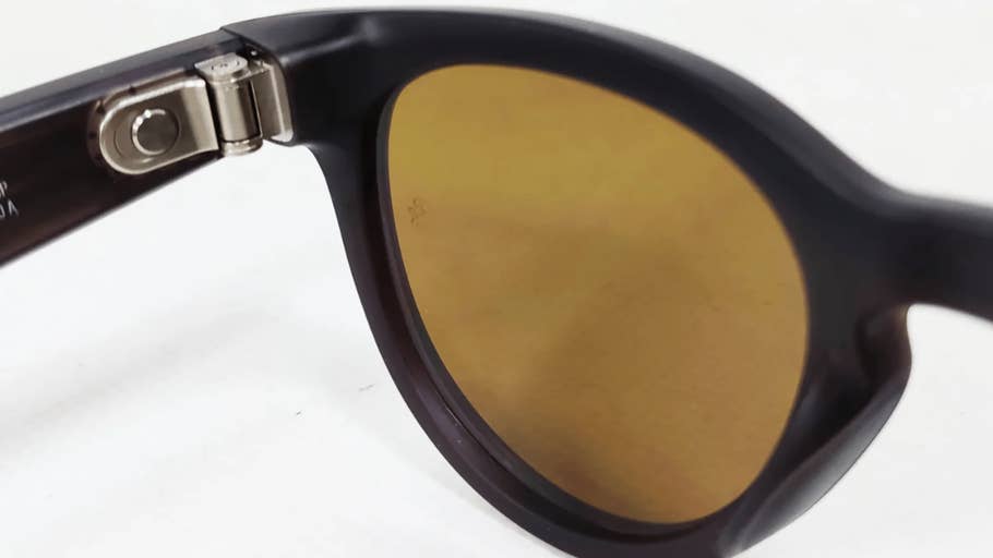 Close up of the Ray-Ban Meta Headliner sunglasses with brown lenses and dark frame.