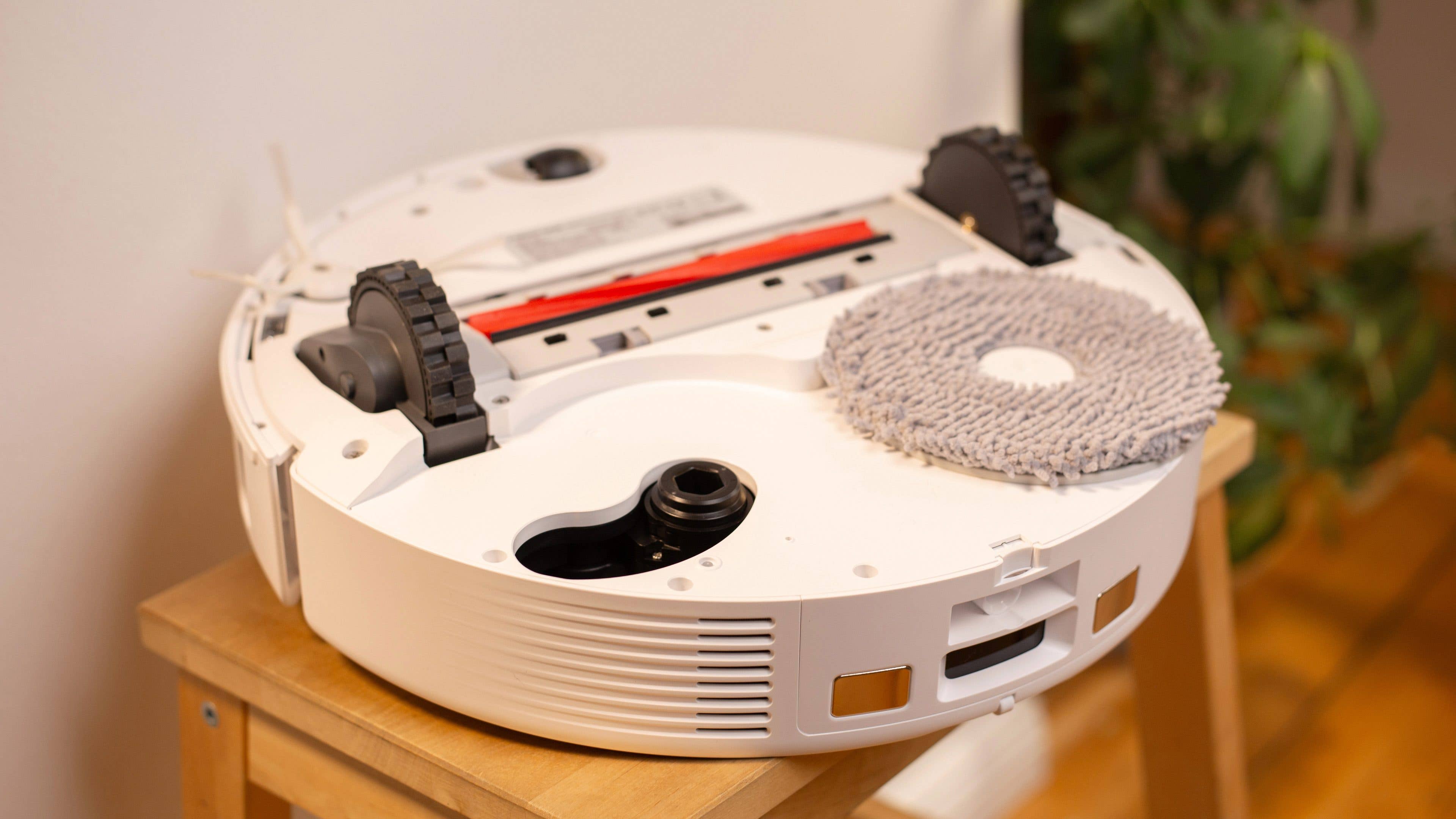 The Roborock Q Revo MaxV with its retractable mop that is accompanied by a fixed side brush at the back..