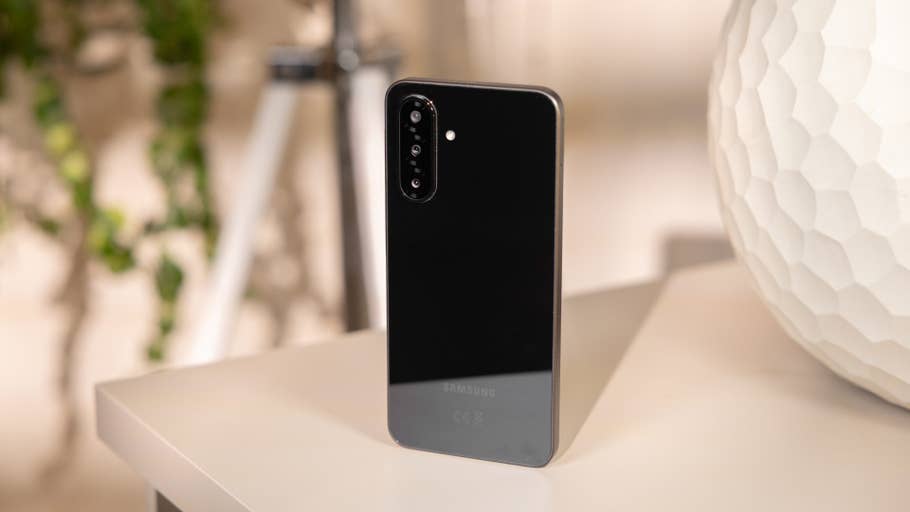 A Samsung Galaxy A26 smartphone lying on a white table.