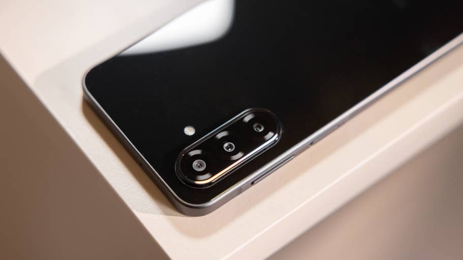 Close-up of the Samsung Galaxy A26 smartphoneu0027s rear camera module on a light surface.