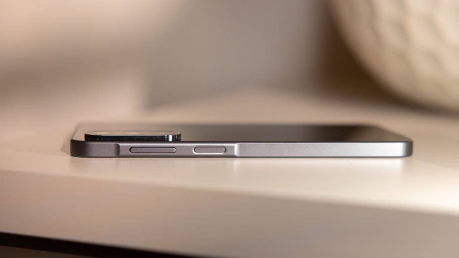 Side view of a Samsung Galaxy A26 smartphone on a table.