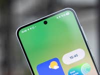 Top portion of a Samsung Galaxy A-series smartphone displaying a green screen with app icons and the time 15:45.