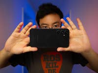 nextpit editor holding the Samsung Galaxy A54