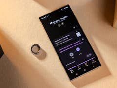 A Samsung Galaxy phone displaying the Samsung Health app next to a Galaxy Ring.