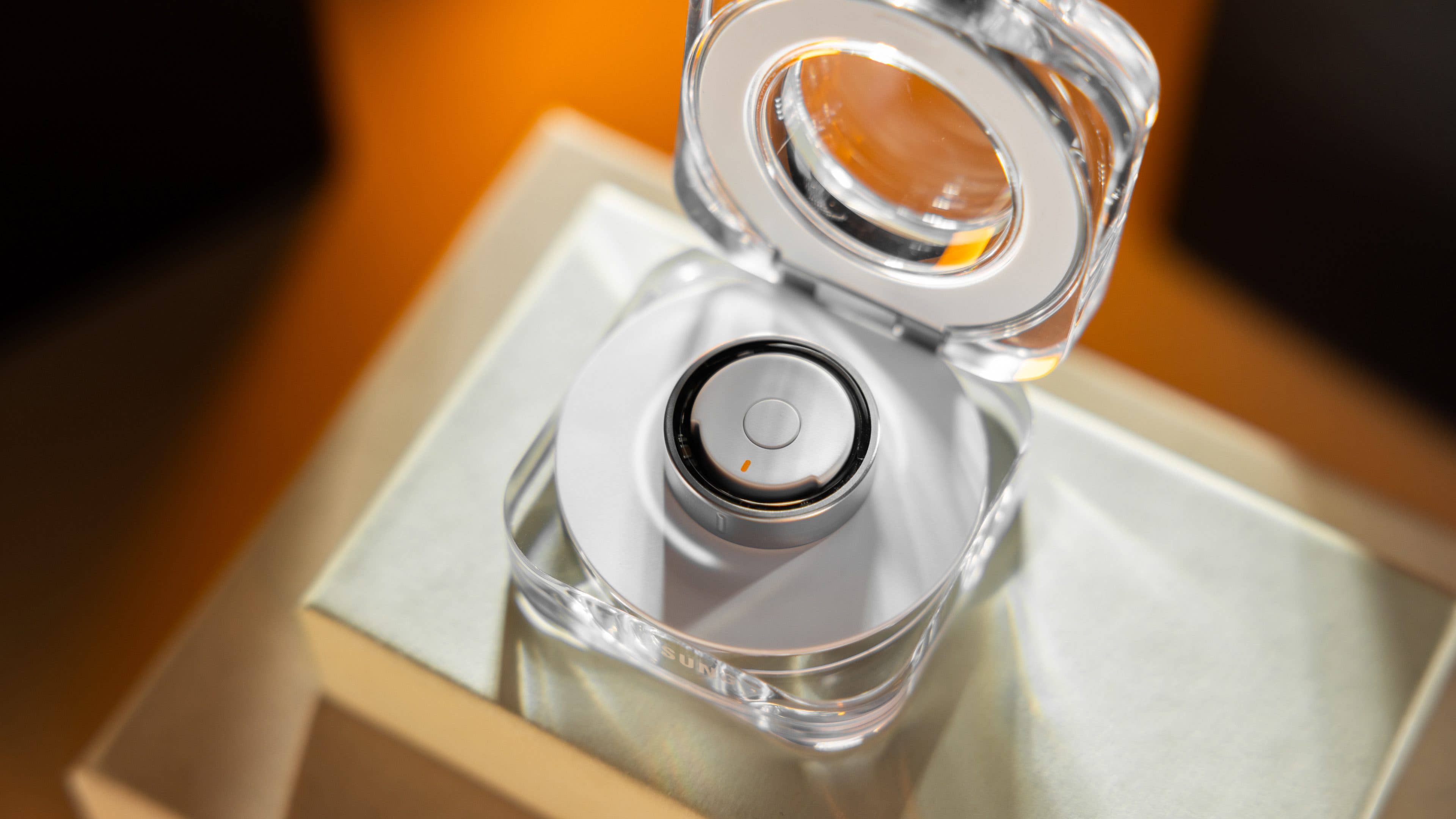 A Samsung Galaxy Ring displayed in a clear case on a light surface. A Samsung Galaxy Ring displayed in a clear case on a light surface.