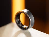 A sleek Samsung Galaxy Ring displayed on a surface with a blurred background.