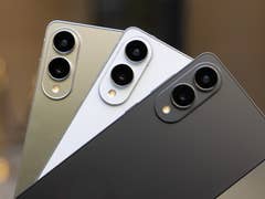 Three Samsung Galaxy S25 Edge smartphones in gold, white, and black, featuring dual rear cameras.