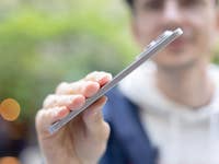 A person holding a Samsung Galaxy S25 Edge smartphone, showcasing its sleek design.