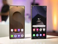 Two Samsung Galaxy S25 smartphones displayed on a table with vibrant backgrounds.