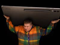 A person carrying the Samsung Galaxy Tab S9 Ultra in their back.