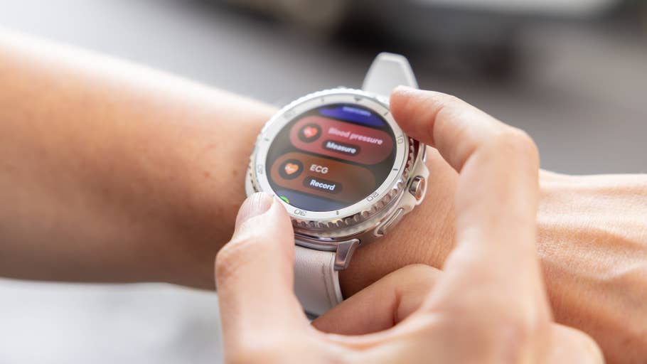 A person interacting with a Samsung Galaxy Watch 8 Classic displaying health metrics.