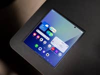 Samsung Galaxy Z Fold7 with a colorful app interface on a flat surface.