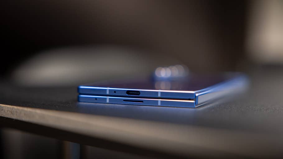 Two Samsung Galaxy Z Fold 7 smartphones on a table, showcasing their sleek blue design and USB-C ports.