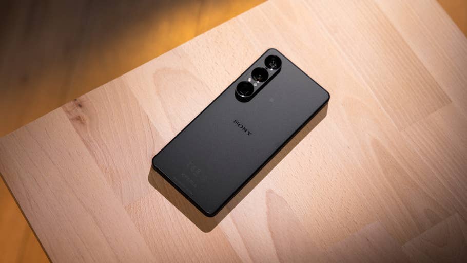 A Sony Xperia 1 VIII smartphone, black, resting on a wooden surface.