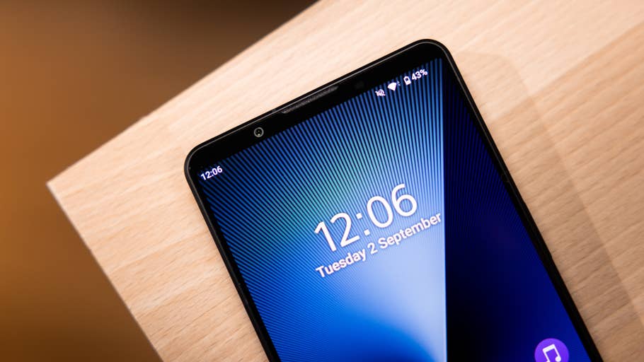 Close-up of a Sony Xperia 1 VIII smartphone displaying the time 12:06 and date Tuesday 2 September.