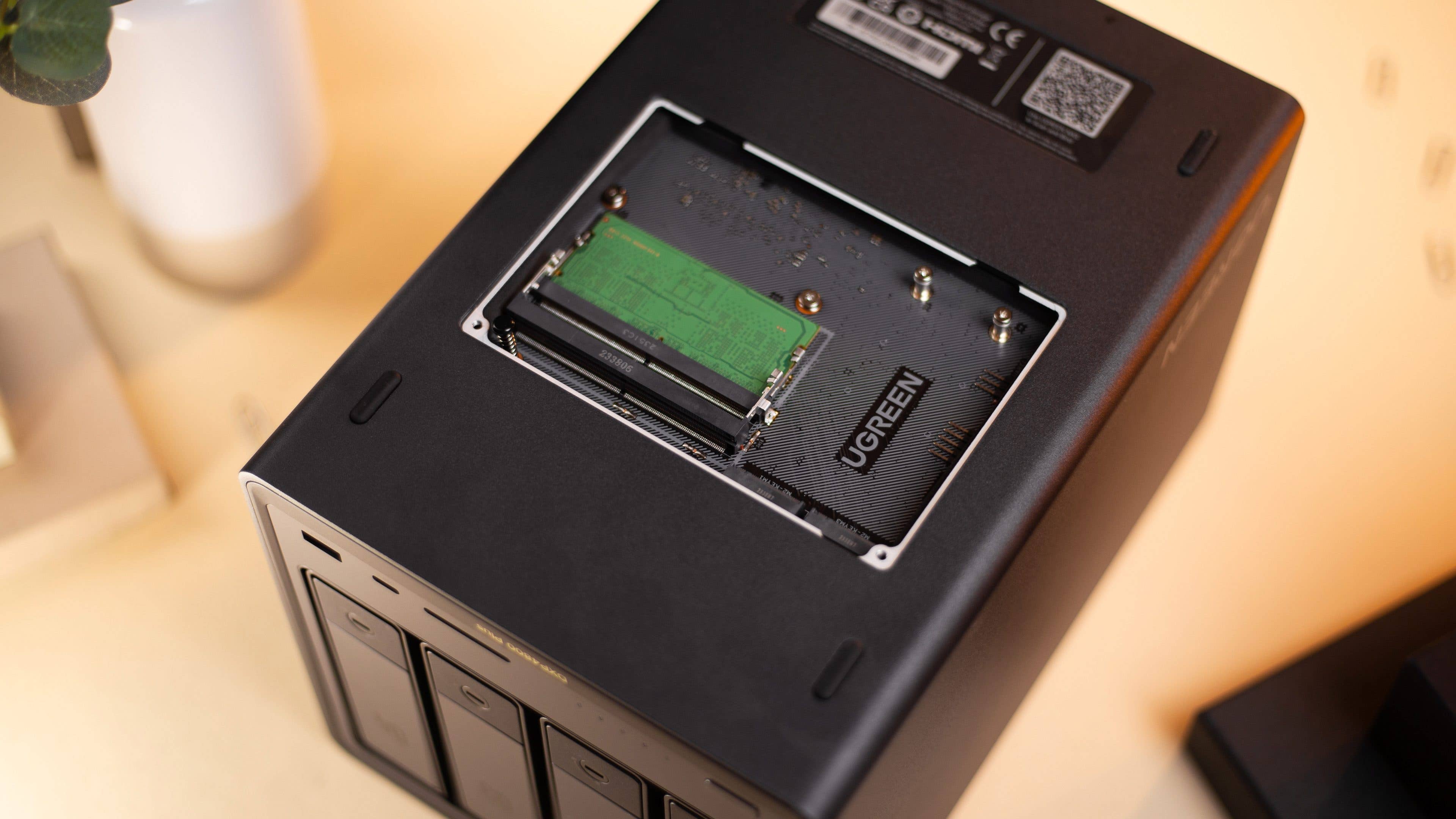 UGreen DXP4800 Plus bottom panel opened with upgrade slots for RAM and m.2 SSDs