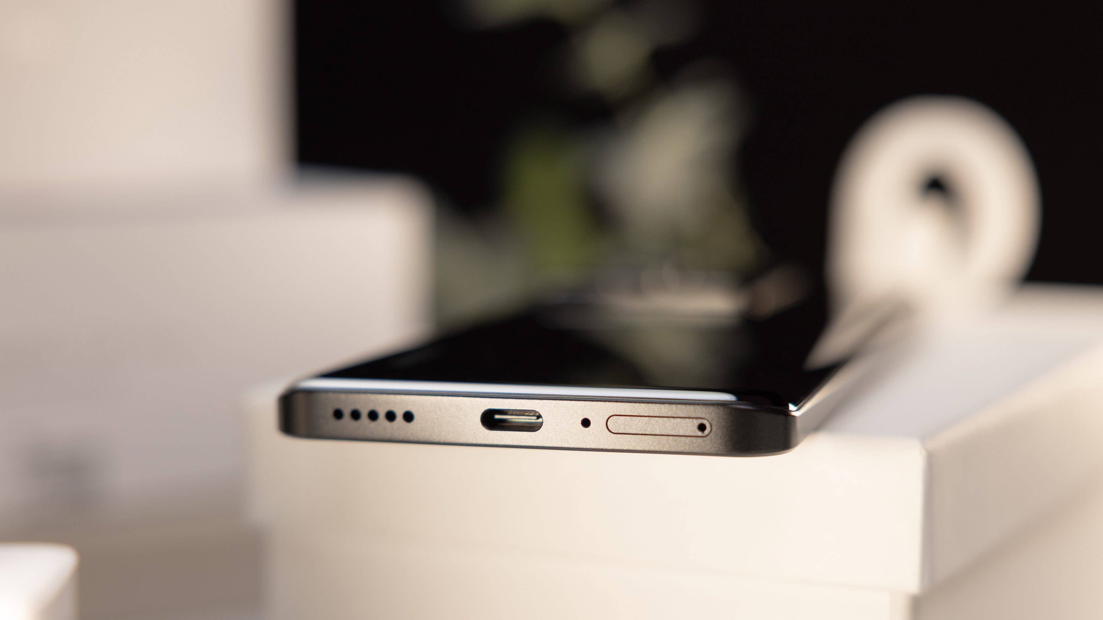 Xiaomi 13T Pro underside showing the USB-C port, speaker grille, and SIM card tray. Xiaomi 13T Pro underside showing the USB-C port, speaker grille, and SIM card tray.
