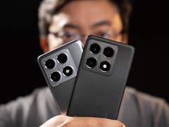 A person holding two Xiaomi 14T Pro smartphones, one in gray and one in black, against a dark background.