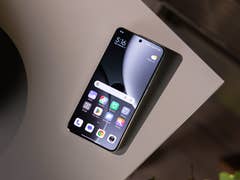 Xiaomi 15 Ultra smartphone displayed on a table, showing the home screen and app icons.