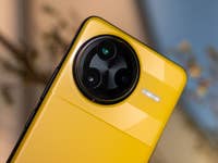 Close-up of a yellow Poco F7 Ultra smartphone showcasing its camera design.
