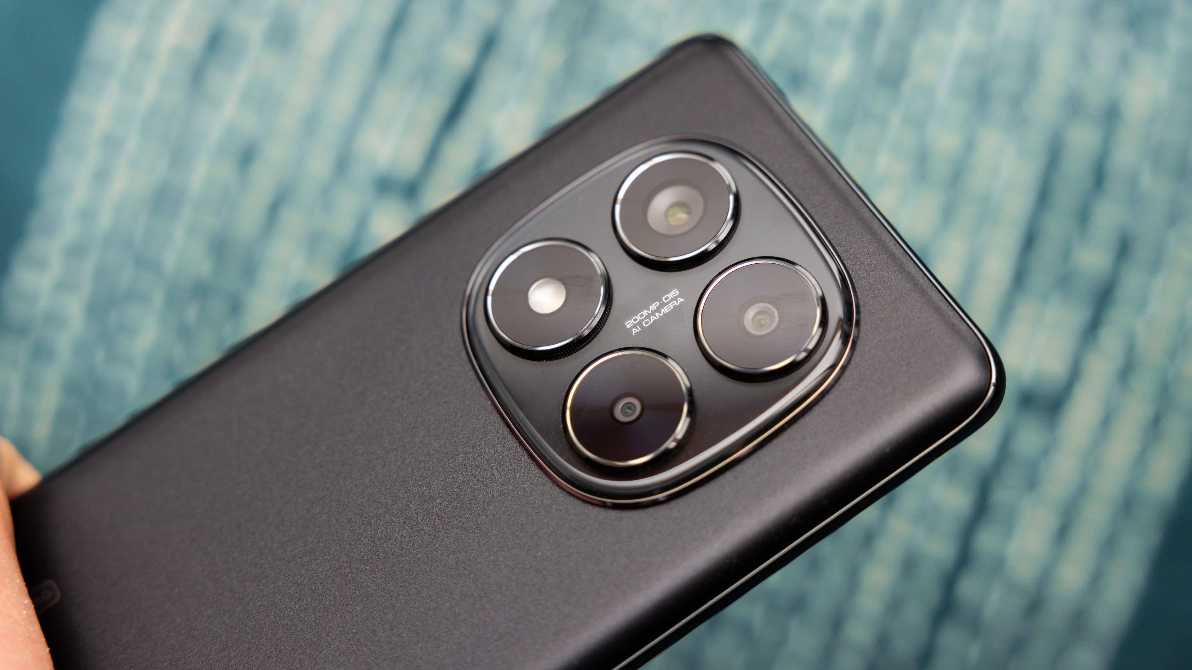Close-up of the Xiaomi Redmi Note 14 Pro 5G smartphone showcasing its triple camera setup.