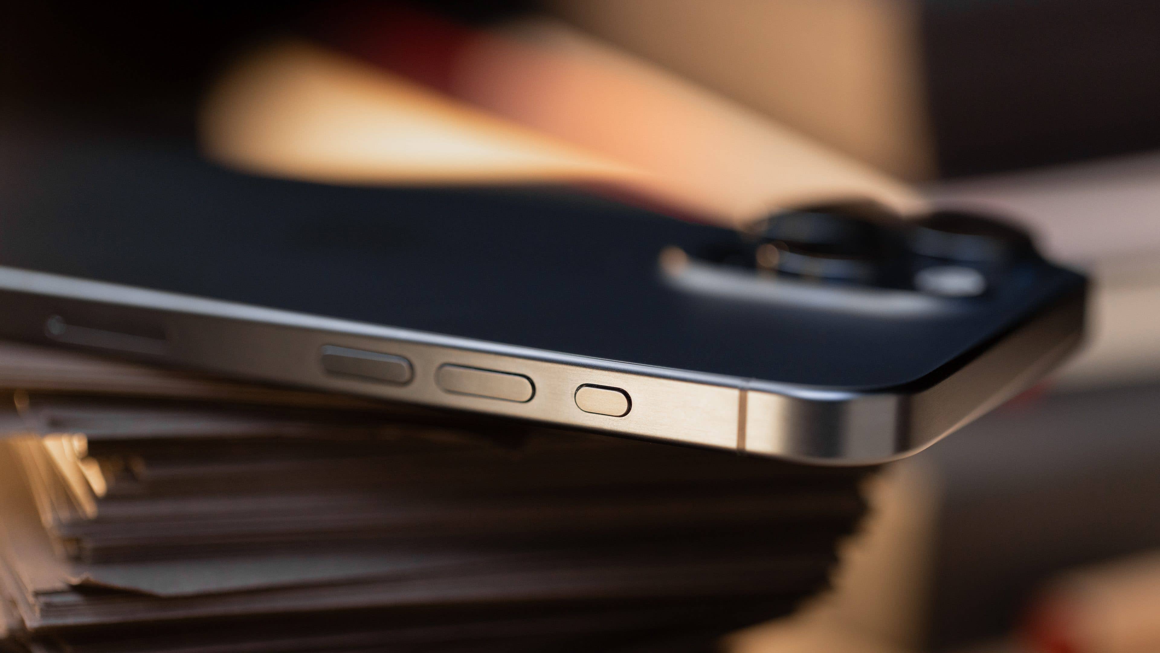 The iPhone 15 Pro Max viewed from the side showing the new Action button The iPhone 15 Pro Max viewed from the side showing the new Action button