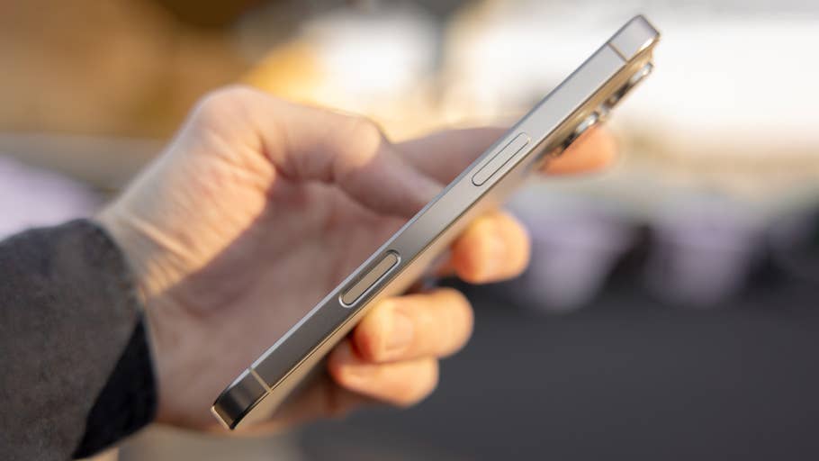 A person holds an iPhone 16 Pro and shows off the side buttons and sleek design.