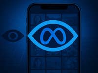 A smartphone displaying the Meta logo with an eye symbol on a blue background.