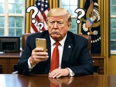 A man sitting at a desk looking at his phone with a puzzled expression, flags in the background.