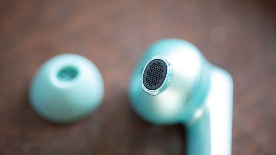 Close-up of the OnePlus Buds 4 earbuds with removable silicone tip.