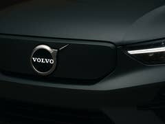 A close-up view of Volvo logo on an electric vehicle/car.