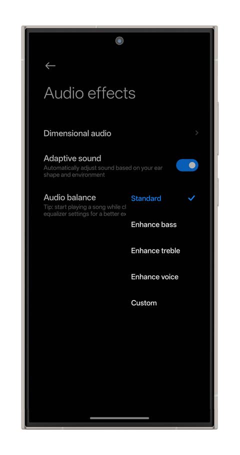 Settings for audio effects on a smartphone, showing options for adaptive sound and audio balance.