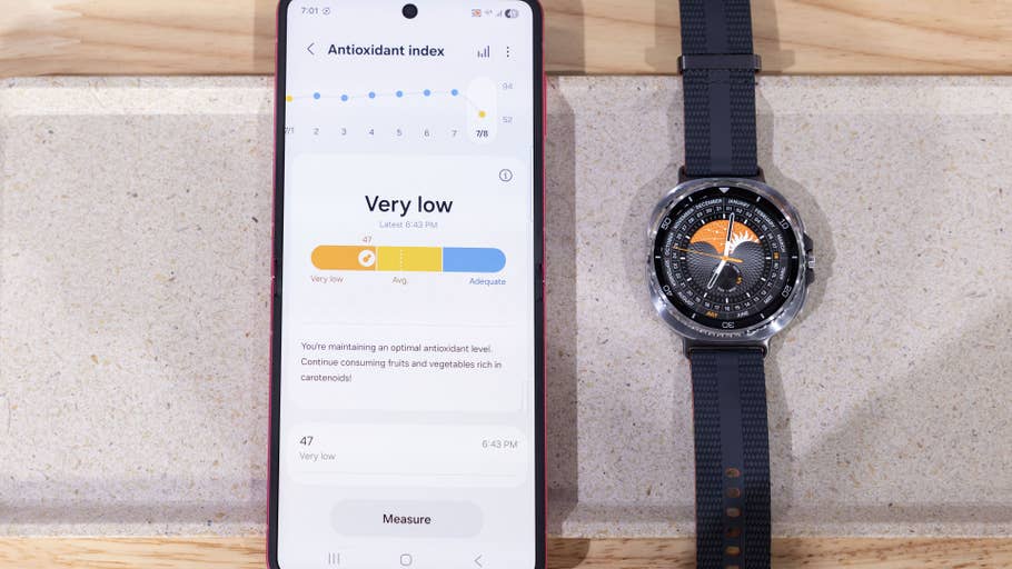 A Samsung Galaxy Watch 8 Classic next to a phone displaying antioxidant index information.