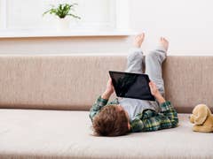 Child playnig with a tablet